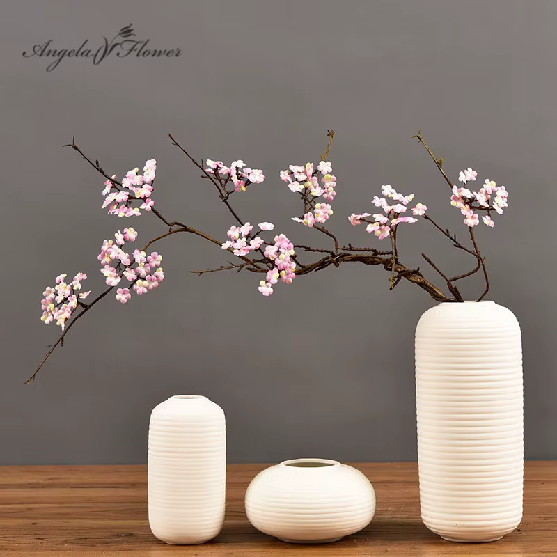 Branche de canne à fleurs de cerisier