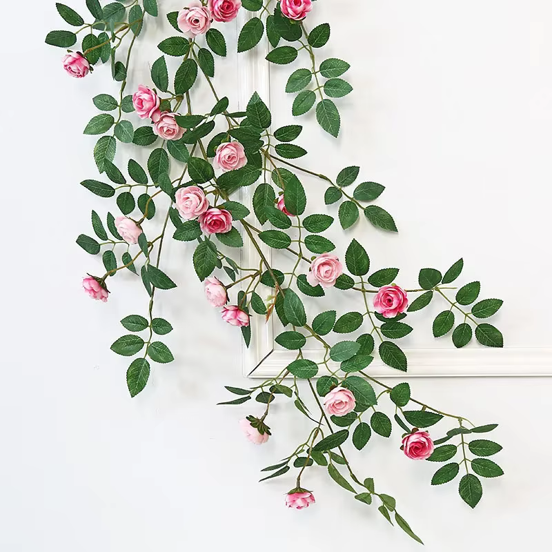 Guirxiété de plantes vertes artificielles en rotin rose