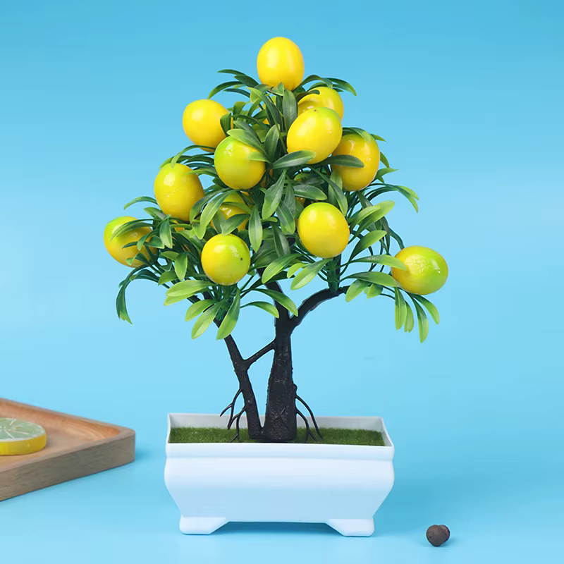 Plantes artificielles de citron en pot