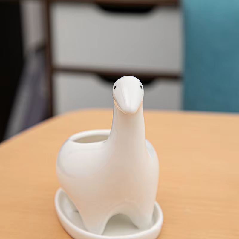 Pot de fleur de dinosaure en céramique blanche