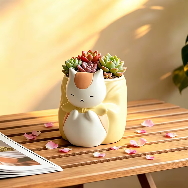 Pot de fleurs en résine chat bouffon endormi
