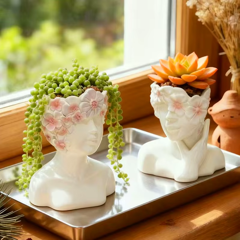 Pot de fleurs en résine en forme de jeune fille