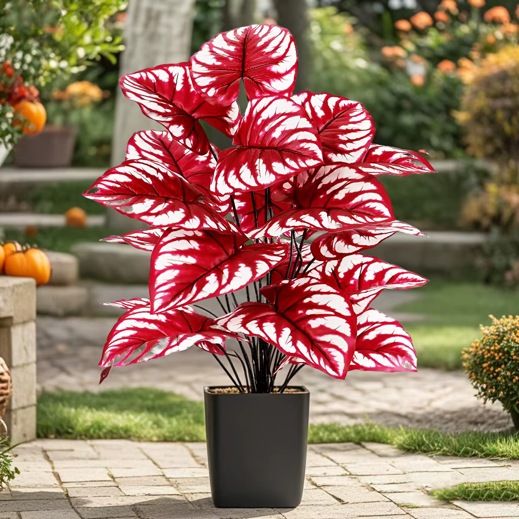 Plante artificielle à feuilles rouges avec rayures blanches