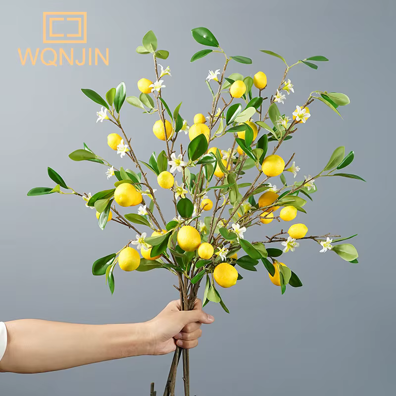 Branche de fruits de citron de luxe avec feuilles vertes