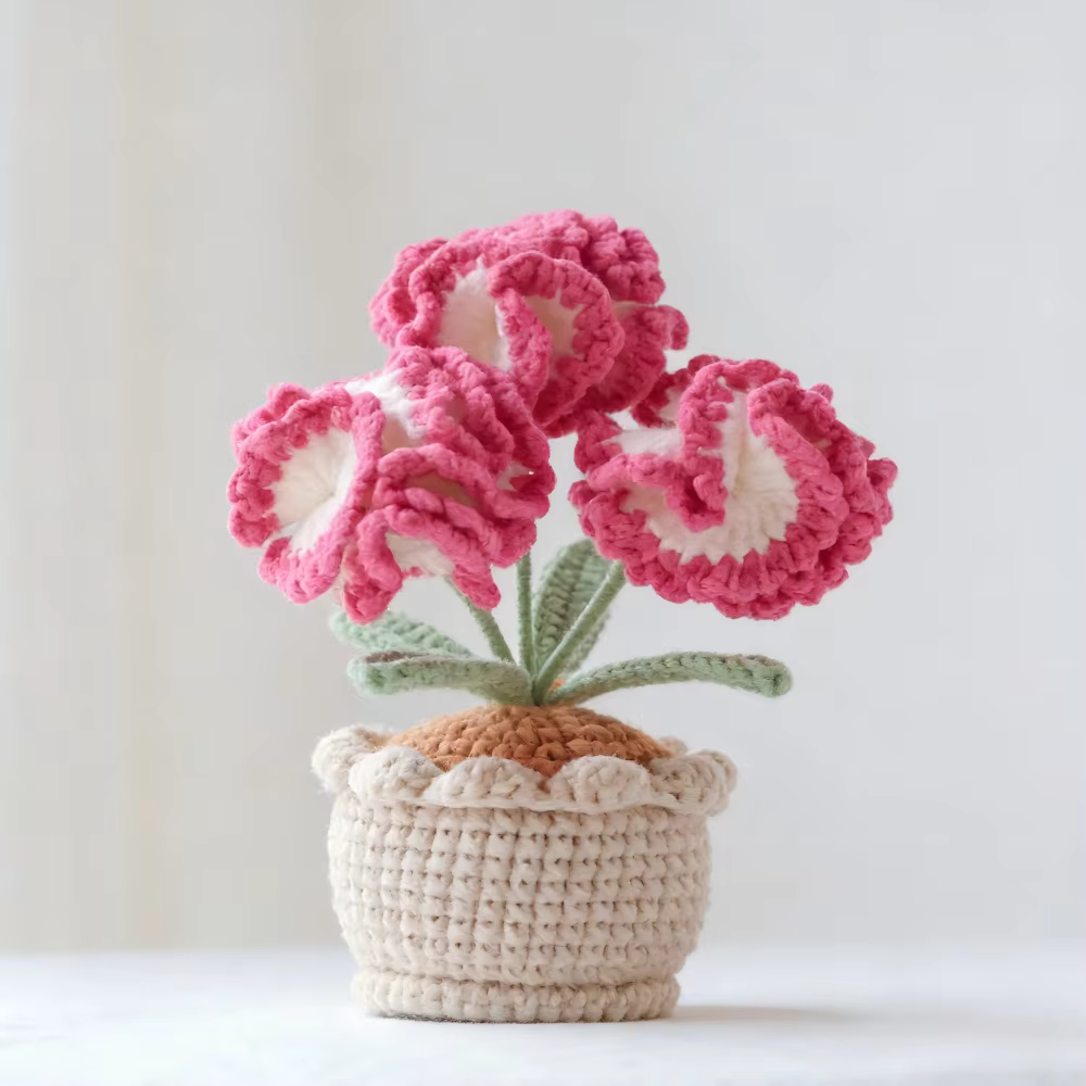 Plante en pot de carnations en laine crochetée à la main