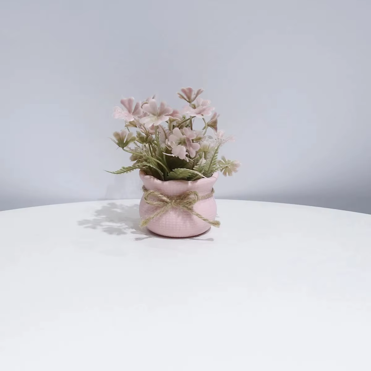 Mini-fleurs artificielles roses en pot