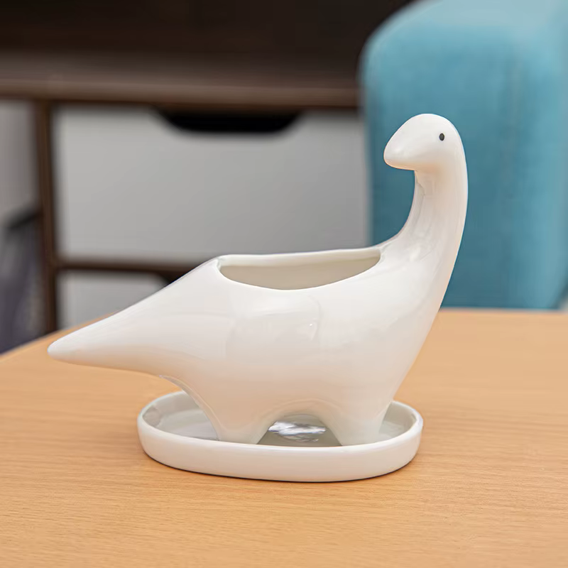 Pot de fleur de dinosaure en céramique blanche