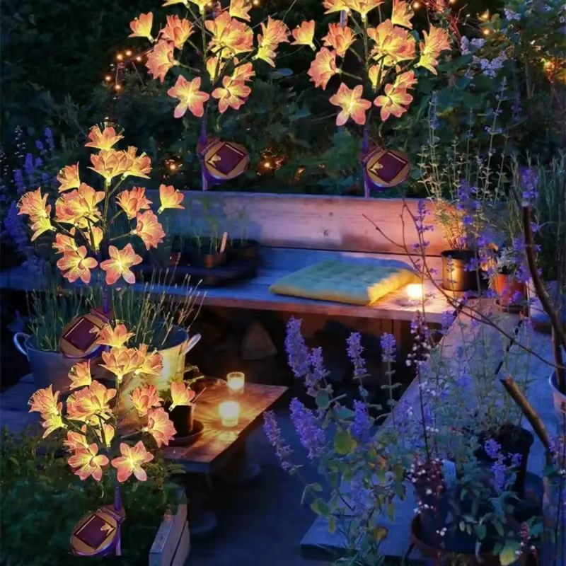 Lampe solaire à piquer en terre en forme de fleur de camélia