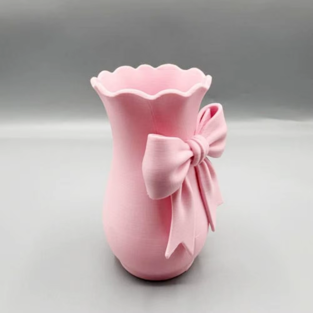 Vases à fleurs en forme de nœud rose au design torsadé
