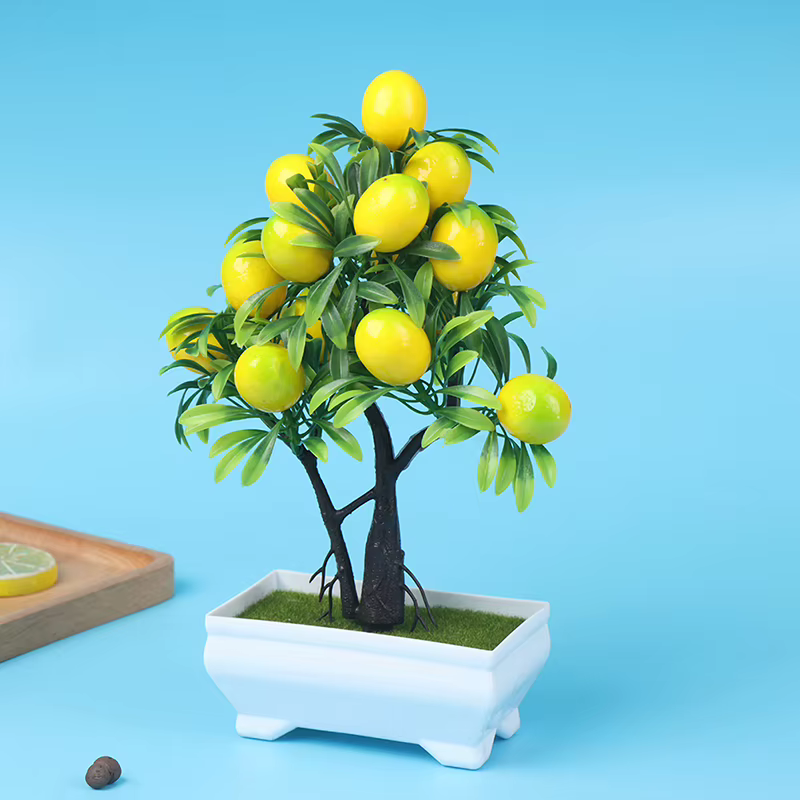 Plantes artificielles de citron en pot