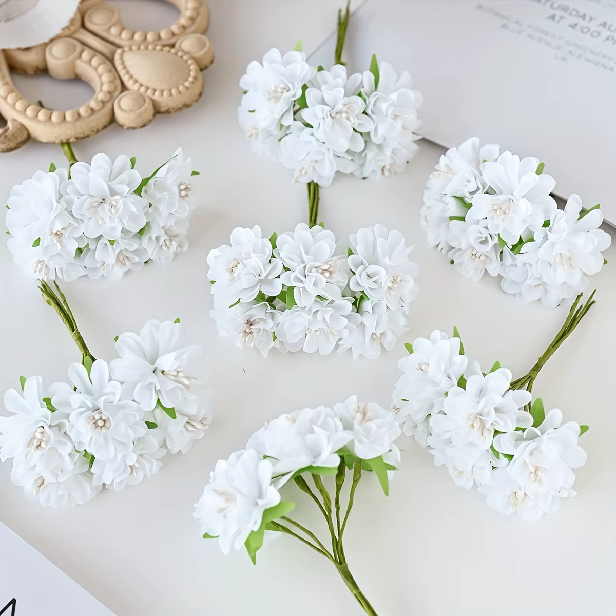 Oeillet de fleurs en soie simulée
