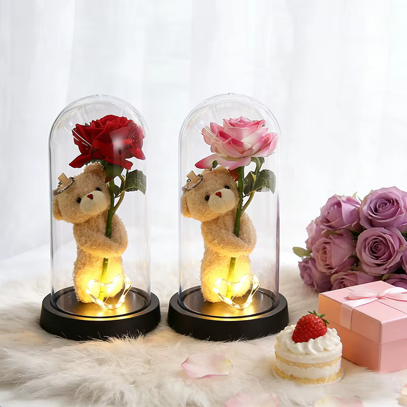 Roses éternelles artificielles en feuille métallique dans un verre