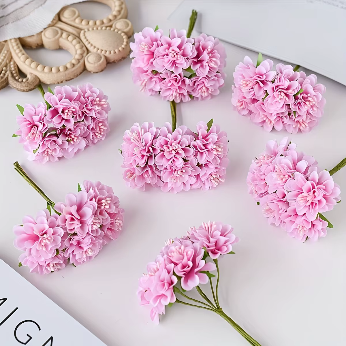 Oeillet de fleurs en soie simulée