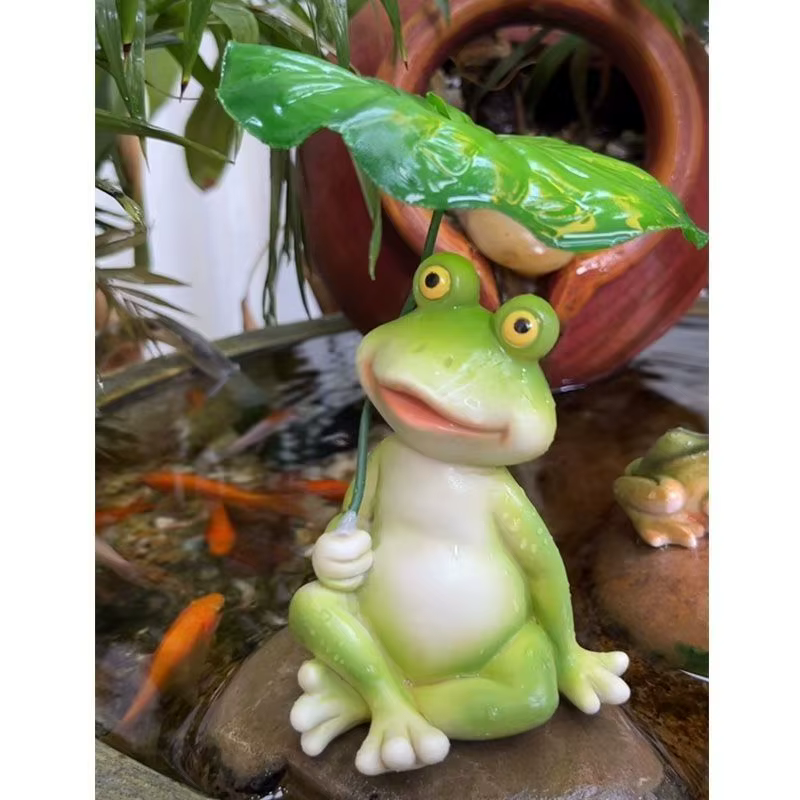 Figurine de grenouille sur feuille en résine