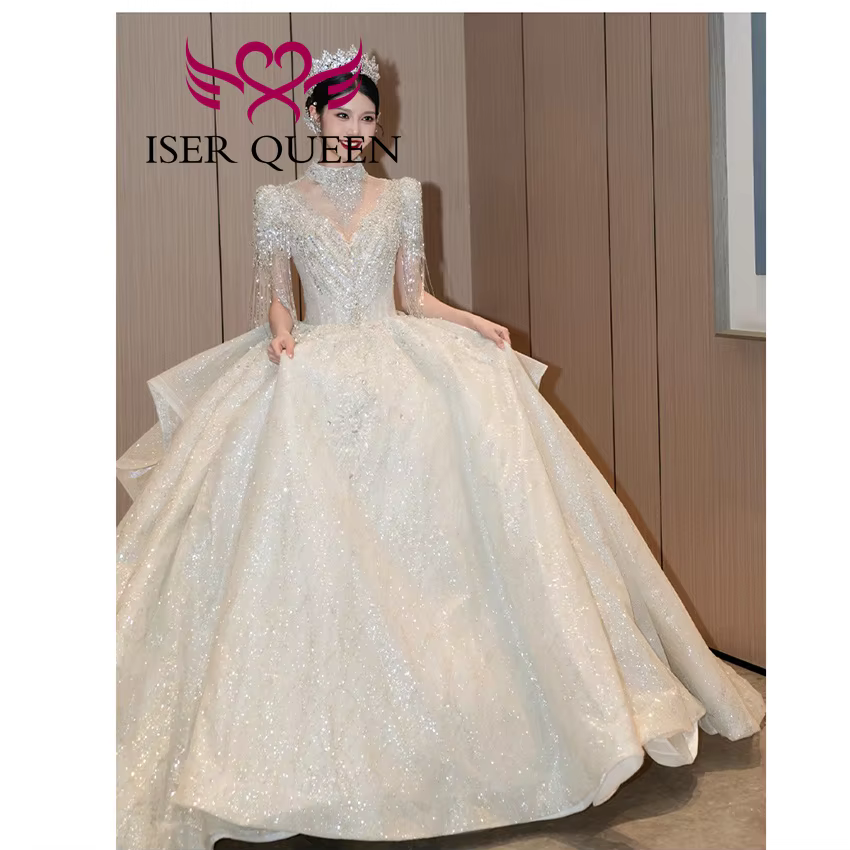 Robe de mariée de luxe personnalisée, nouvelle tendance 2026, pour femme, col montant, manches à franges, perles lourdes, robes de mariée scintillantes WX0474