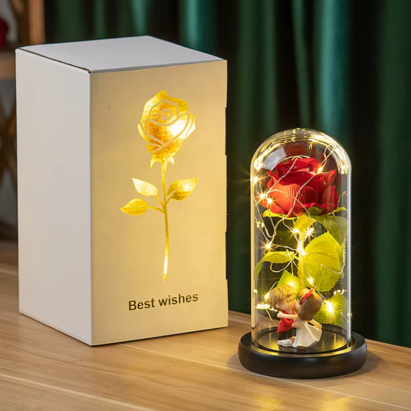 Roses éternelles artificielles en feuille métallique dans un verre