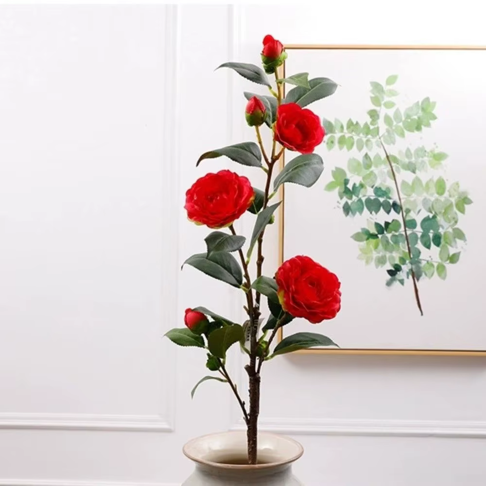 Fleur de camélia artificielle à feuilles vertes