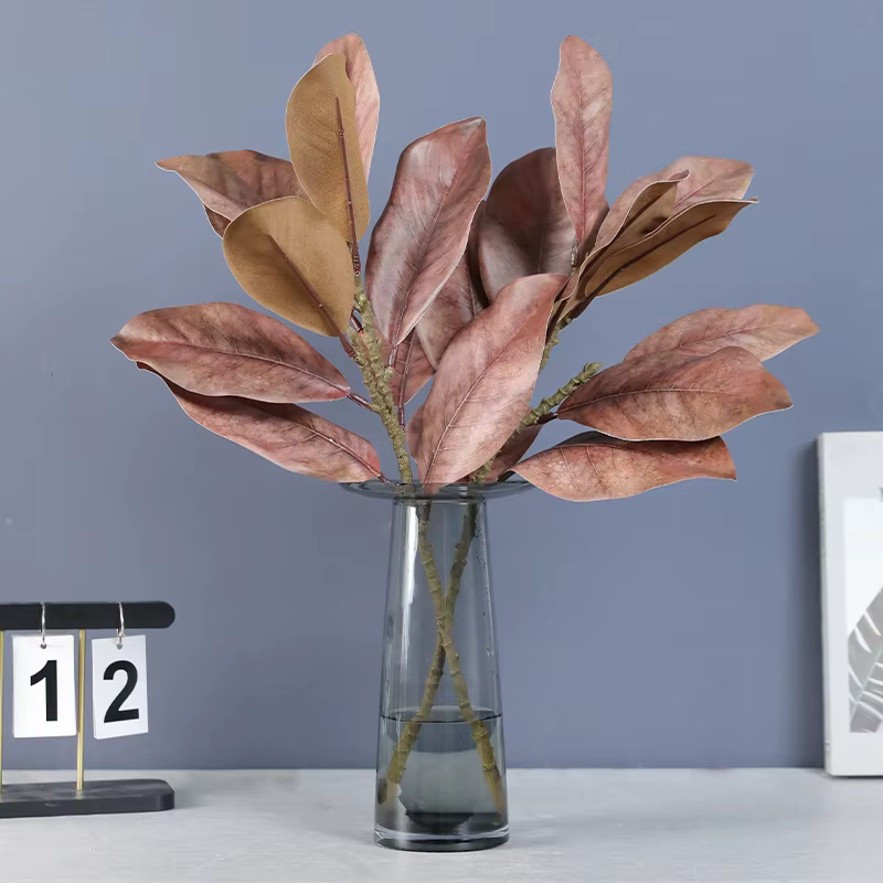 Plantes artificielles en feuilles de magnolia simulées