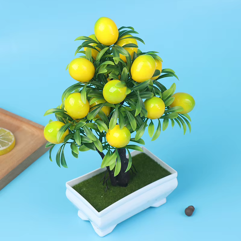 Plantes artificielles de citron en pot