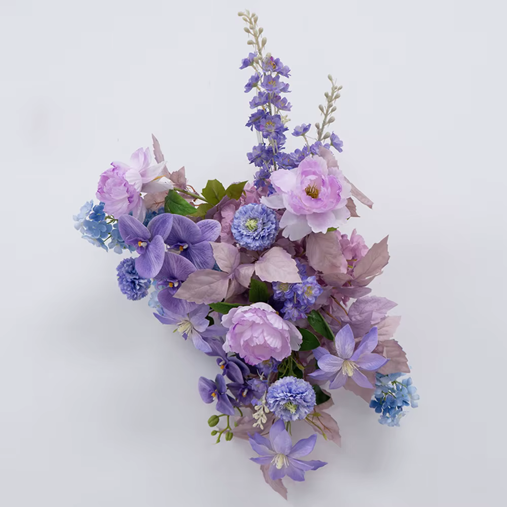 Arrangement de fleurs artificielles violettes luxueux